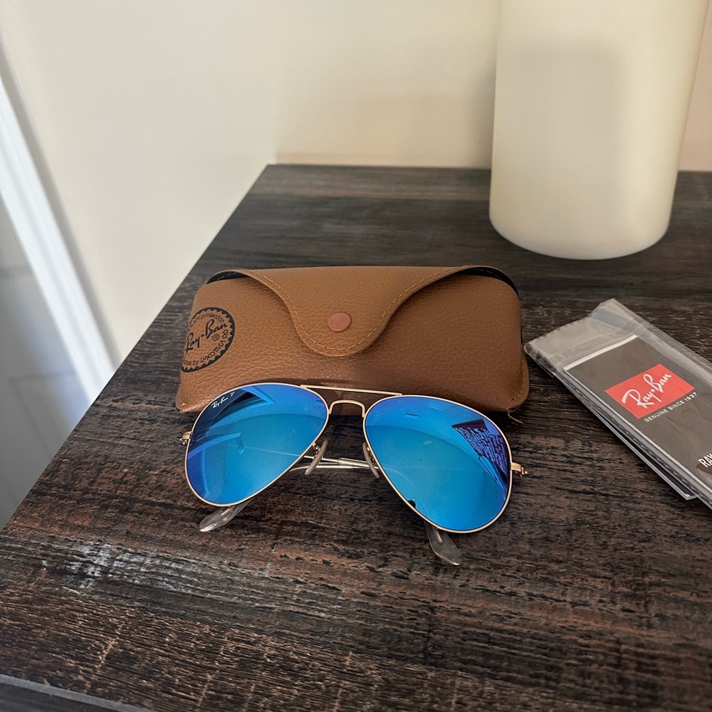RayBan aviators. Gold frames with polarized lenses.